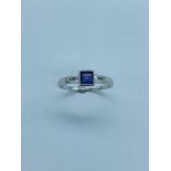 9ct White Gold ring with a 5.2mm square set Amethyst and two diamonds to each shoulder Size M.
