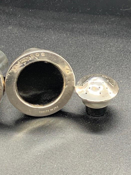 A Silver salt and pepper casters - Image 2 of 3