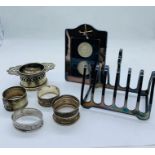 A selection of silver and silver plated items to include picture frame, toast rack etc