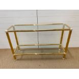 A gilt framed glass console table