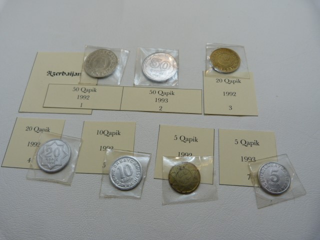 A selection of seven coins from Azerbaijan to include 50 Qapik, 50 Qapik, 20 Qapik, 20 Qapik, 10