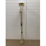 A brass two-light task floor lamp