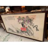 A large framed oriental print featuring cherry blossom, signed