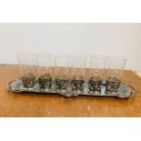 An Art Nouveau Six piece glass set with white metal holders and tray.