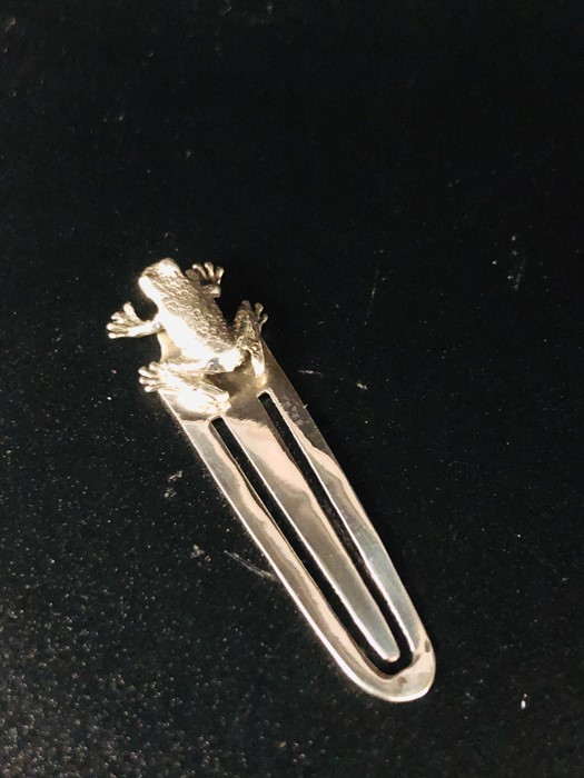 A Silver Bookmark with Frog finial.