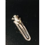 A Silver Bookmark with Frog finial.