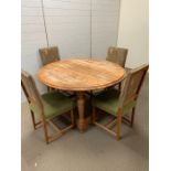A solid round dining table with four matching chairs (H76cm W126cm D126cm)