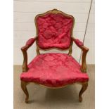 A gilt Louis XV style open armchair
