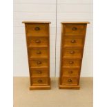A pair of pine tower six drawers