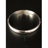 A Silver Bangle with hinged clasp