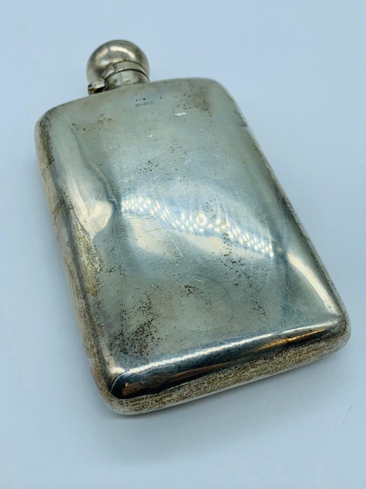 White Metal Hip flask with indistinct hallmarks.