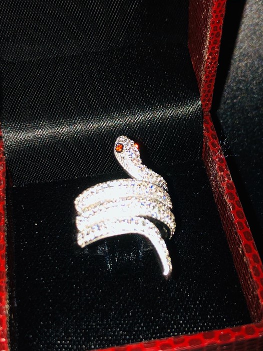 An unusual silver and CZ snake shaped ring. - Image 2 of 2