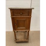 A marble topped pot cupboard