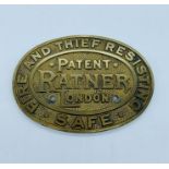 A brass safe plaque by Ratner of London