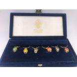 Faberge Egg enamelled wine glass charms in Faberge presentation box, set of six.