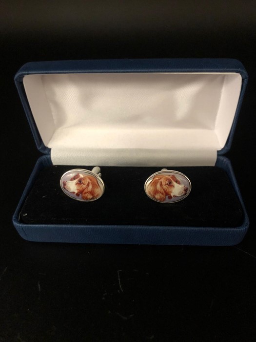 A Pair of silver and enamel cuff links depicting a dog, cased. - Image 2 of 2