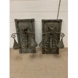 A pair of metal wall hanging depicting dragons, could be rewired into lights