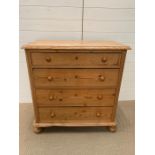 A four drawer pine chest of drawers with lockable drawers (no keys) (H90cm W90cm D48cm)