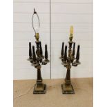 A pair of ornate brass and ormolu four arm candleabra on marble base (one arm AF)