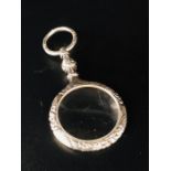 A Silver Pendant necklace in the form of a magnifying glass
