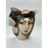 A contemporary pottery vase, unknown signature painted with a ladles face and long flowing hair