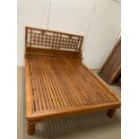 A 5ft wooden bed with headboard