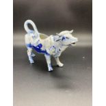 An Early Delft Cow Creamer (H13cm W 18cm)