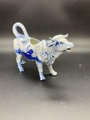 An Early Delft Cow Creamer (H13cm W 18cm)