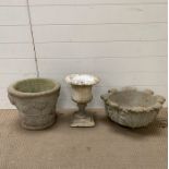 Two re-pressed stone plant pots and a Roman style urn planter