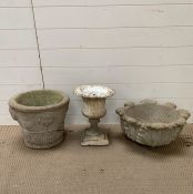 Two re-pressed stone plant pots and a Roman style urn planter