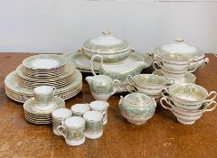 A Wedgwood Dinner Service in bone china gold Columbia sage green, to include six two handles soup