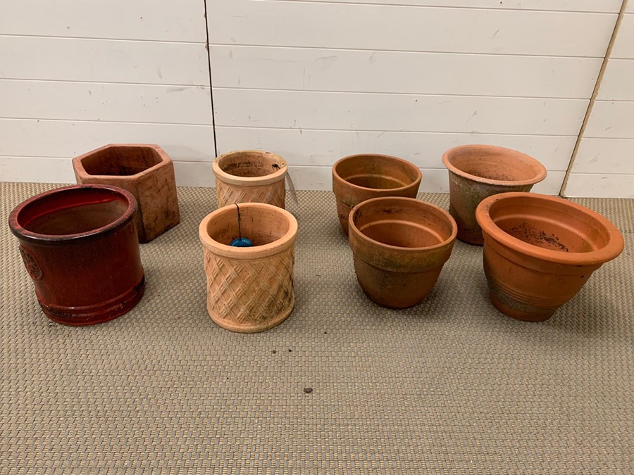 A selection of eight terracotta and glazed pots