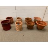 A selection of eight terracotta and glazed pots