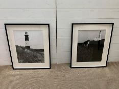 A Pair of Black and White framed photographs of lighthouses in black frames.
