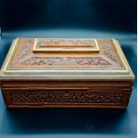 A 19th Century Carved Sewing Box with inlay.
