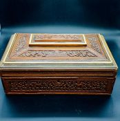 A 19th Century Carved Sewing Box with inlay.