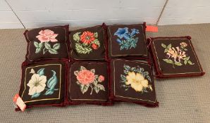 A Selection of Eight needlepoint cushions worked with flowers these are from The Duarte Pinto Coelho