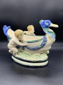 A Baden German China Fruit bowl in Bird form with Cherubs(H22cm W29cm)