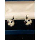 A Pair of Silver and Enamel Set Cuff links depicting a Pug Dog