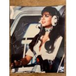 Signed photograph of Caroline Munro in "The Spy Who Loved Me" helicopter scene James Bond movie