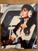 Signed photograph of Caroline Munro in "The Spy Who Loved Me" helicopter scene James Bond movie
