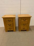 Two oak bedside tables (H69cm W50cm D40cm)