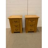 Two oak bedside tables (H69cm W50cm D40cm)