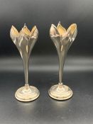 A pair of silver plated tulip bud vases