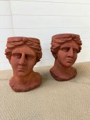 A pair of head themed plant pots (approx. H46cm)