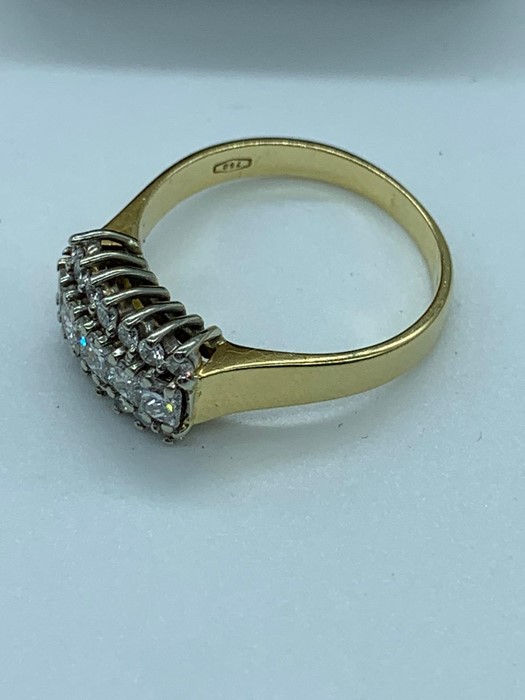 An 18ct yellow gold diamond set cluster ring. Consisting of wide flat section shank in yellow - Image 2 of 3