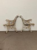 Two vintage metal bench ends