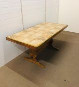 A tile topped farmhouse kitchen table (H 76 cm x L 165 cm x W 85 cm)