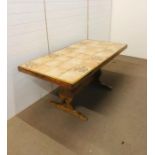 A tile topped farmhouse kitchen table (H 76 cm x L 165 cm x W 85 cm)