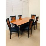 A contemporary Kesterport dining table with four chairs and two carvers (H 76cm x L 200cm x W